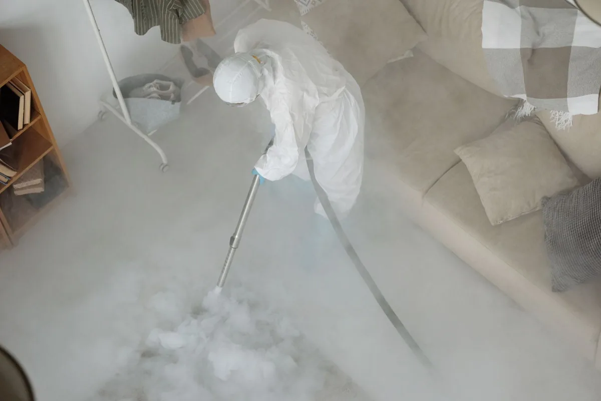 Biohazard cleanup technician in protective equipment, Madison, MS